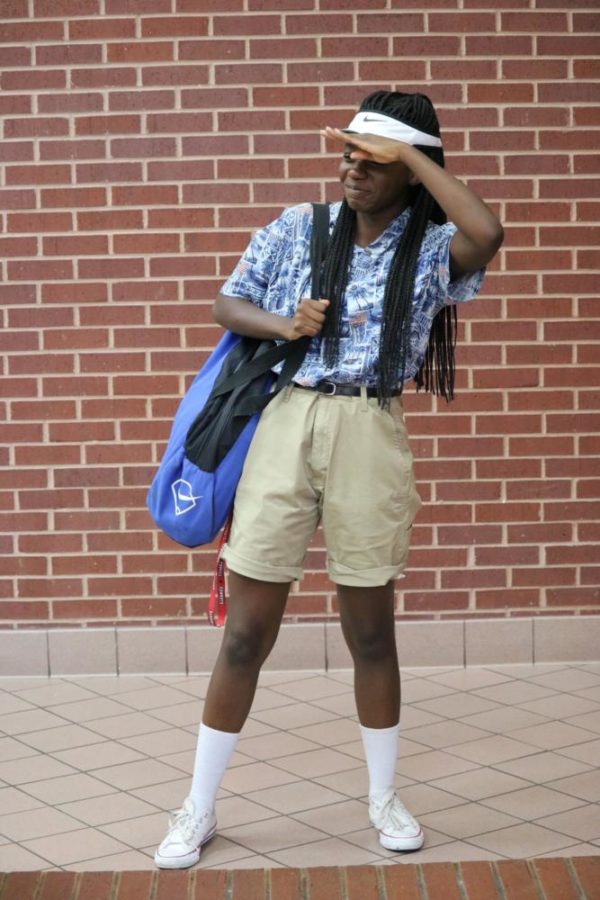 Coppell High School senior Grace Kompany accomplishes the full look for tacky tourist day today. Coppell High School students take part in celebrating homecoming week by dressing up for the different theme days. 