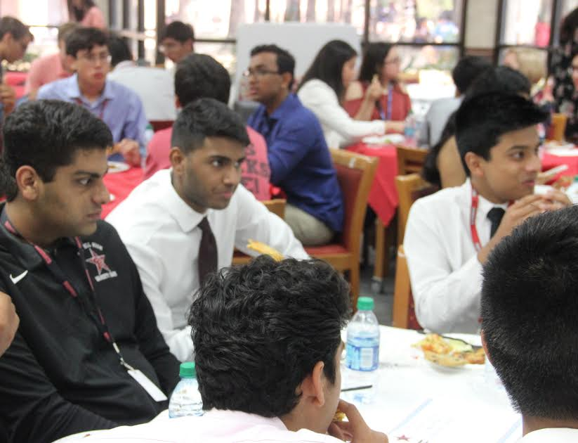Coppell High School seniors spend lunch on Thursday in the library for the National Merit luncheon. This luncheon is held to honor and recognize select students chosen by the National Merit Scholarship Corporation for their top qualifying scores on the PSAT nationwide.