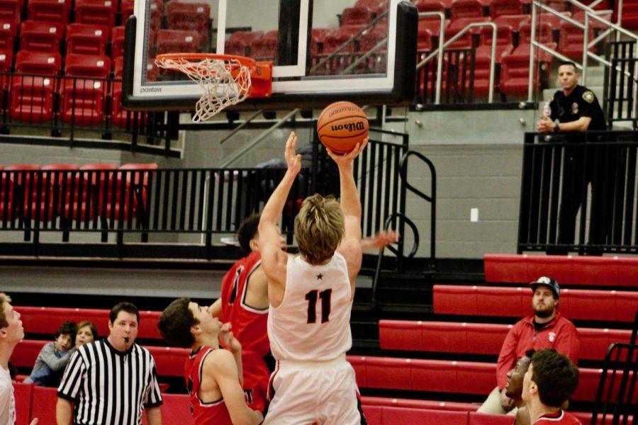 Coppell High School senior small forward Kevin Galvin shoots a layup during the game against the Trinity Trojans at the Coppell High School Arena on Nov. 29. The Coppell Cowboys defeated the Trinity Trojans, 58-49.