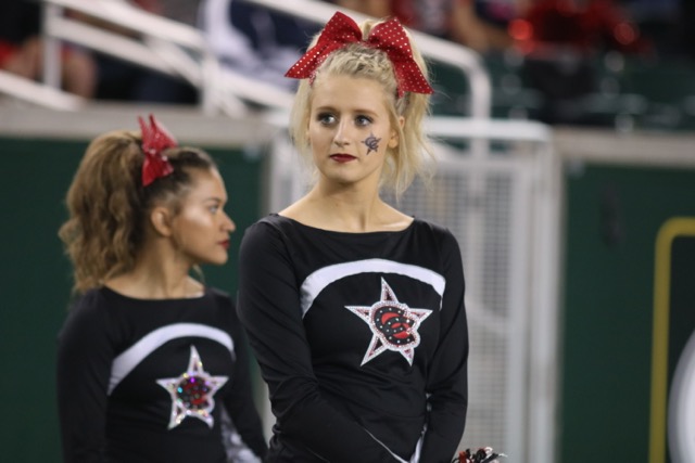 Coppell High School senior cheerleading captain Avery Zaves looks on as the Coppell football team plays at McLane Stadium in Waco on Dec. 2. Zaves has been on varsity for three years.
