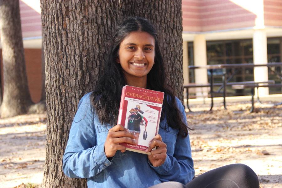 Sidekick staff writer Pramika Kadari holds a copy of The Overachievers by Alexandra Robbins. The Overachievers is a nonfiction book that explores the problematic pressures of today's society, focusing on eight high school and college students’ lives. 