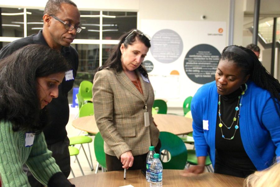 Valley Ranch PTO Board co-president Ritu Sethi, Coppell ISD Trustee Anthony Hill, Executive Director of Teaching and Learning Deana Dynis and Dean of Public Health at West Coast University Sharonda Wallace sort through question cards based on their thoughts on education at the first Educational Summit at Richard J. Lee Elementary on Thursday night. This card sort is one of the activities that will allow Coppell ISD to analyze feedback for their strategic design efforts.