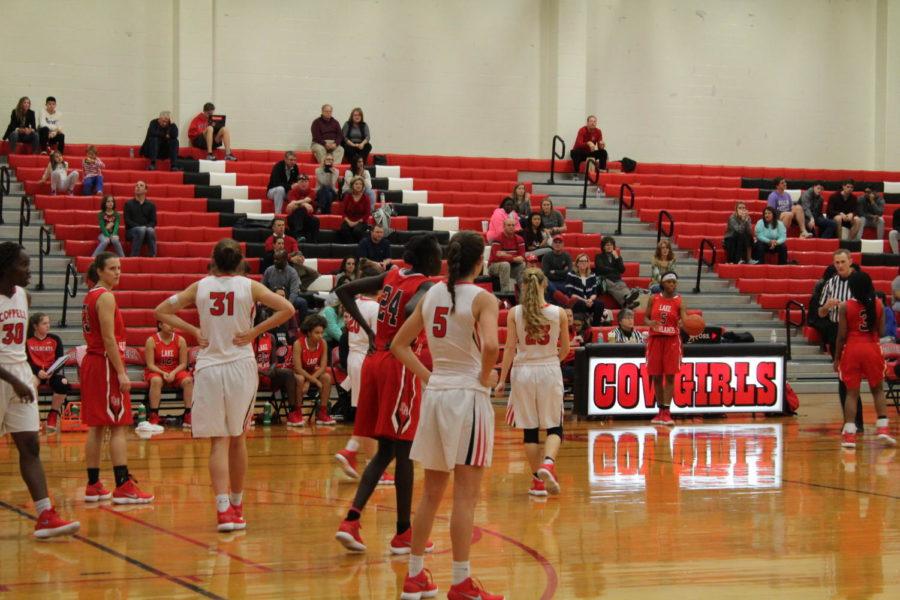 Coppell High School sophomore Chloe Hassman and the rest of the Cowgirls play defense against the Lake Highlands Friday night. The Coppell Cowgirls defeated the Lake Highlands girls basketball team 40-32 making the Cowgirls win their first District 9-6A game of the season in the School’s Big Gymnasium
