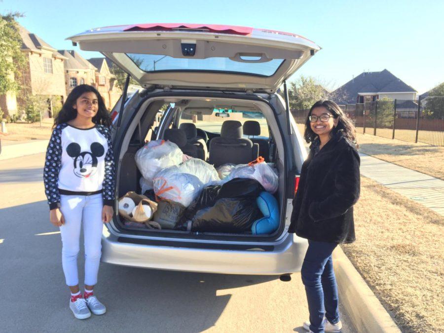 Sophomores Pooja Cheruku and Laasya Madana collect the donations they received through their drive held on Jan. 13. All donations, including clothes and toiletries will be donated to the Salvation Army in order to raise awareness for the issue of homelessness.