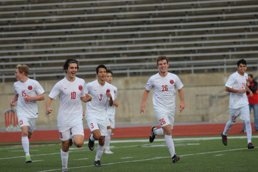Coppell Cowboys senior midfielder Wyatt Priest celebrates with teammates after scoring the first goal of the tournament game on Jan. 4 at Buddy Echols Field. The Coppell Cowboys defeated the La Joya Huskies 2-0. 