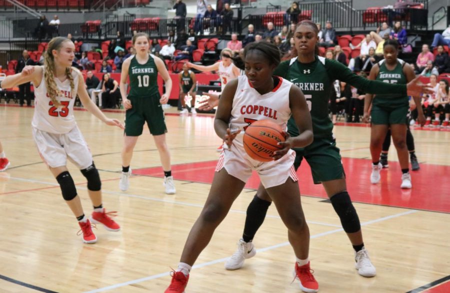 Coppell High School junior center Nicole Obialo boxes out to get a clear pass. The Coppell girls basketball team played against Berkner at the CHS Arena on Tuesday, Feb. 6 winning 58-34, (Sidekick File).