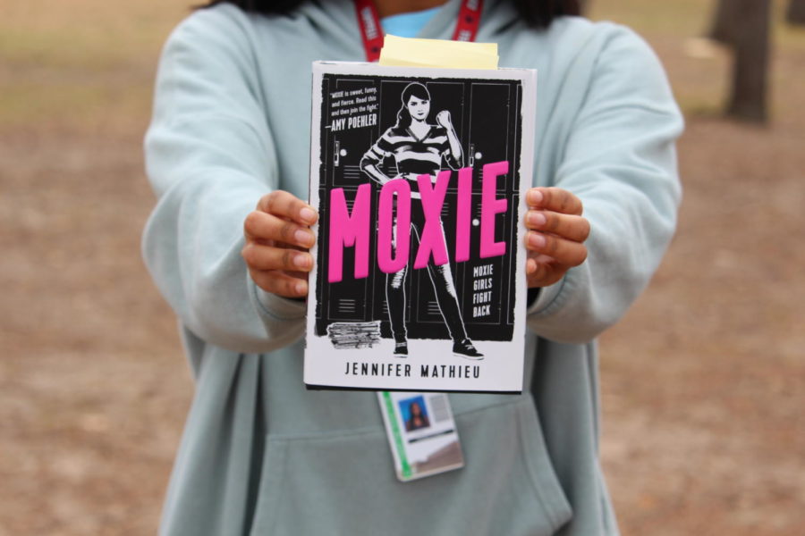 The Sidekick’s Wren Lee reviews Moxie by Jennifer Mathieu for the upcoming authors event at William T. Cozby Public Library on Feb. 24.. She also connects the novel with the Riot Grrrl movement, which is an underground feminist punk movement that originated in the 1990s. 