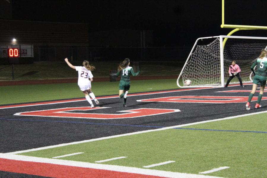 Coppell High School girls varsity soccer team went against Berkner High School on Tuesday night. Sophomore Haley Roberson stole the ball from the lady rams and tried to score with a powerful kick. Photo by Quyenh Phang.