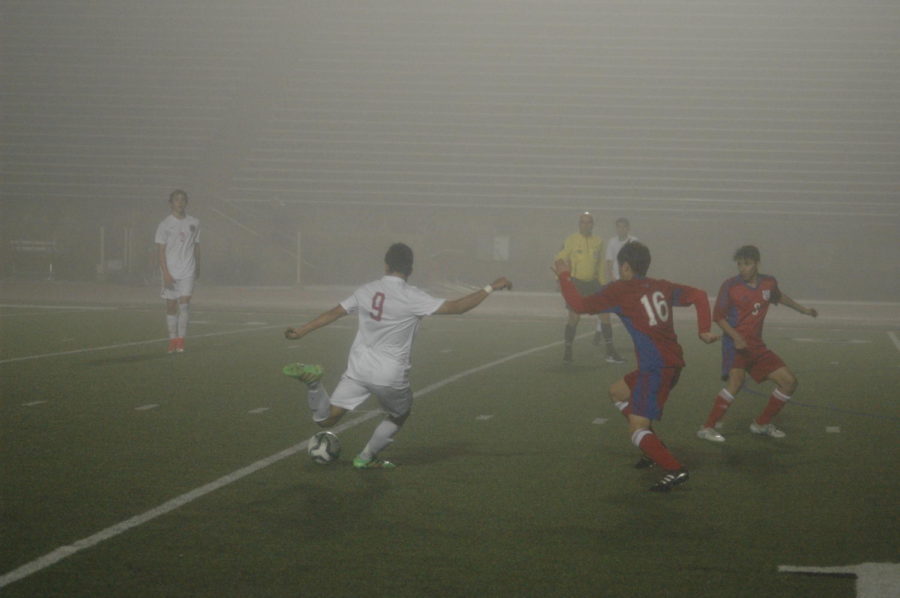 Coppell senior forward Juan Pablo Rodriguez strikes the ball for a shot on goal against J.J. Pearce on Tuesday night at Buddy Echols Field. The Cowboys lost to the Mustangs, 1-0, on Tuesday night.


