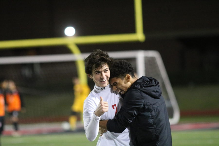 Coppell Cowboys senior forward Francisco Redondo hugs senior fullback defender Marshall Board after he makes a goal during the second half of the game on Feb. 9 at Buddy Echols Field. The Coppell Cowboys defeated the WT White Longhorns 2-1. 