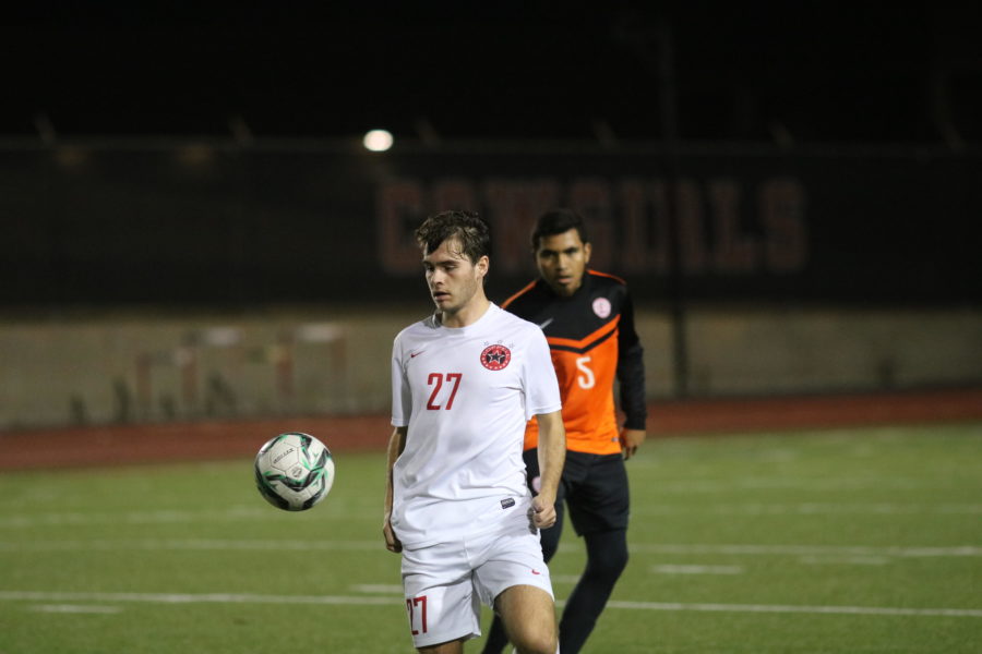 Coppell Cowboys senior forward Jared Gast kicks the ball during the second half of the game on Feb. 9 at Buddy Echols Field. The Coppell Cowboys defeated the WT White Longhorns 2-1.