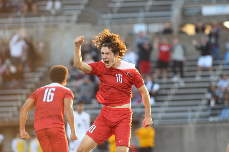 Coppell Cowboys senior midfielder Wyatt Priest jumps with joy after assisting a goal during the second half of the game on March 30 at John Clark Stadium in Plano. The Coppell Cowboys defeated the Garland Owls, 4-0, in the bi-district round of the Class 6A Region I playoffs.