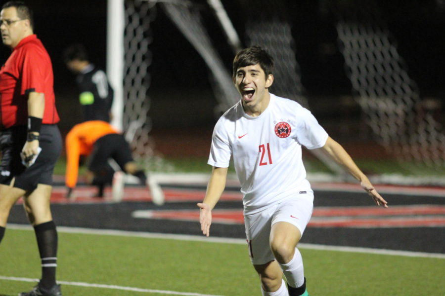 Coppell Cowboys senior striker Cesar Alves runs to celebrate with his team after scoring the final point during the second half of the game on March 9 at Buddy Echols Field. The Coppell Cowboys defeated the Berkner Rams 5-1. 
