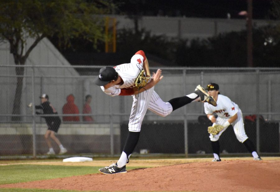 Coppell senior pitcher Rye Gunter delivers the next pitch to a Lake Highlands batter during Monday nights game at the Coppell Baseball/Softball Complex. The first game in the series against the Wildcats resulted in a 4-1 win for the Cowboys.