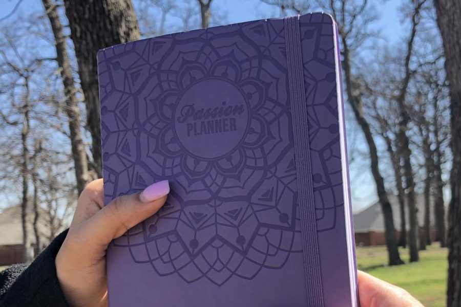 A+Passion+Planner+is+passed+from+one+person+to+another%2C+imitating+the+manner+in+which+free+Passion+Planners+are+given+away+for+each+one+that+is+sold.+Passion+Planners+are+useful+for+setting+and+reaching+goals+while+keeping+track+of+daily+events%2C+assignments+and+plans.