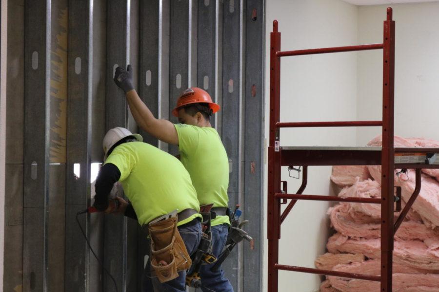 Construction workers begin building the new security vestibule in the storage room of Coppell High School. Students and visitors will be required to check in through the vestibule once first period begins. These renovations will continue through the rest of spring break.
