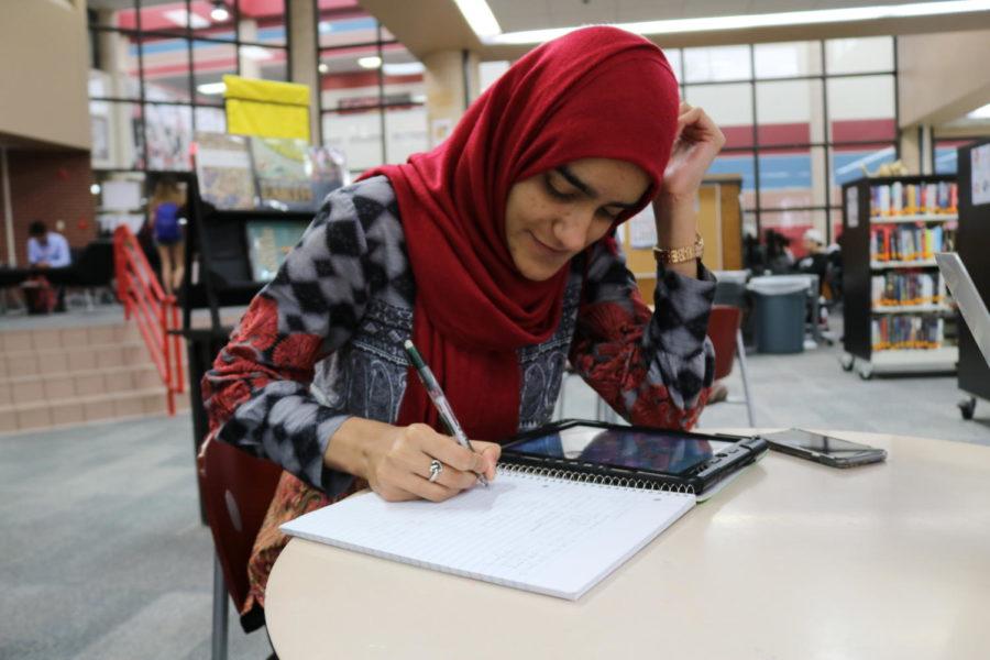 Coppell High School sophomore Hamna Asif goes over her notes for geometry during first period on Friday. Asif is studying for her test over parallelograms and quadrilaterals. 
