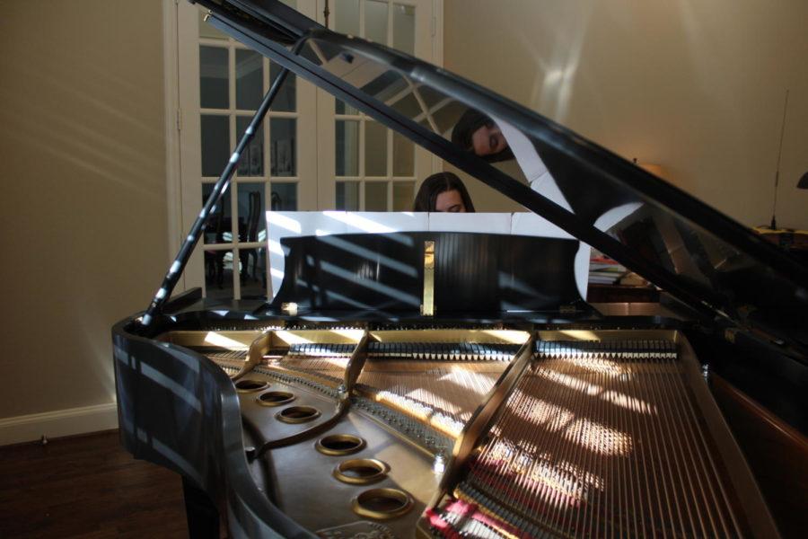 Coppell High School sophomore Anna Judd practices her original piano composition on Sunday at her house. Judd composes many pieces of music, one of which she will be performing at the Purely Rhythmic percussion concert tomorrow at 7 p.m. in the CHS auditorium.