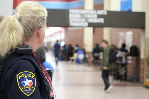 Coppell High School          Student Resource Officer Diane Patterson looks out for students as lunch begins today during sixth period. Having security officers during the school day helps to protect students against any unexpected violence. 
