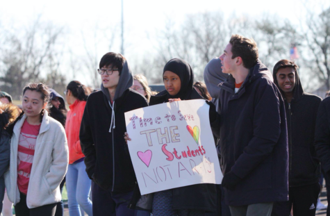 Students at Thomas Jefferson High School for Science and Technology (TJHSST) in Alexandria, Virginia hold signs and stand up for gun restriction. The seniors were not present during the walkout and instead were at the one in Washington, D.C.