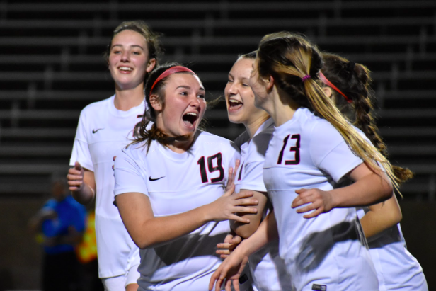 Coppell junior midfielder Shelby Sylvester (no. 19) shows her excitement as the Cowgirls score their fifth goal during the Class 6A Region I bi-district match against Naaman Forest on Thursday night at John Clark Stadium in Plano. The Cowgirls won, 5-0, and advance to play Mesquite Horn on Tuesday in the area playoff.