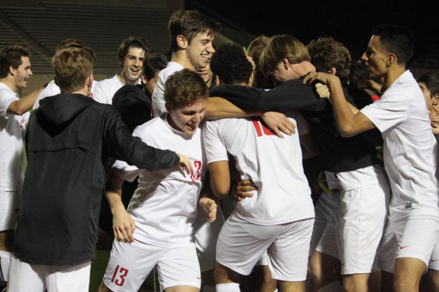 The Coppell Cowboys varsity soccer team celebrates as they score the first goal of the game during the second-half of the game at Buddy Echols Field. The Cowboys won the game against the Wildcats last Friday night, 2-0. Photo by Disha Kohli