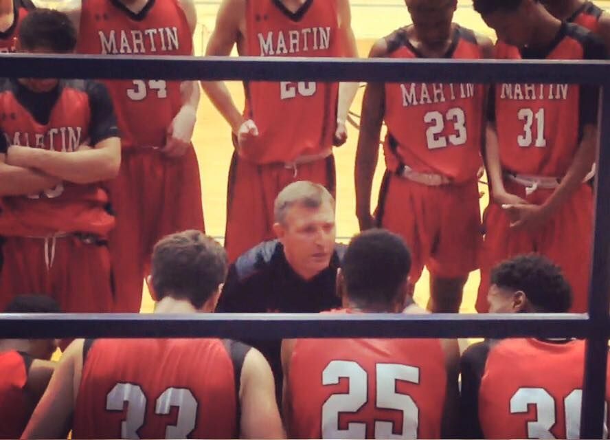 Coach Clint Schnell talks to his Arlington Martin Warriors team during a time out. Schnell has been named the new boys basketball head coach for Coppell High School.