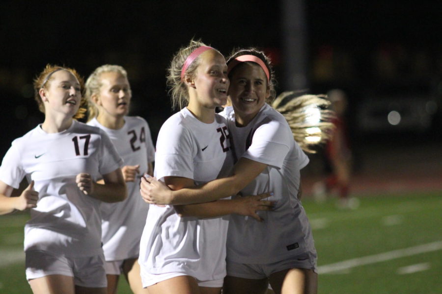 Coppell Cowgirls junior Micayla Weathers (right) and junior defender Mary Ziperman (left) hug as they celebrate the team’s fourth goal during the second half of the game on April 3 at Stade Postell Stadium. The Coppell Cowgirls defeated the Mesquite Horn Jaguars 5-0. 