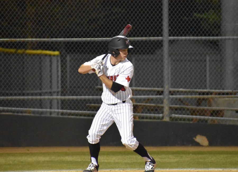 Coppell senior designated hitter Reid Valentine who is sports copy editor for The Sidekick, entered high school with a back injury resulting from years of playing baseball. Valentine’s stress fracture gave him a deeper appreciation for playing the game he loves. 
Photo by Mari Pletta.