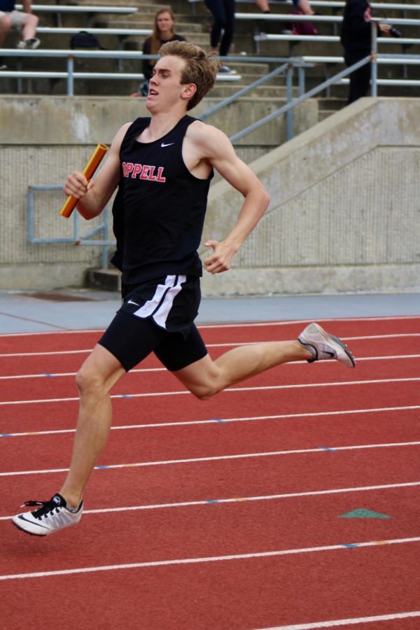 Coppell High School junior Christian Leffingwell runs to place first for the varsity boys 4x400 race during the track meet at Buddy Echols Field on Friday. Coppell High School teams all placed first overall.