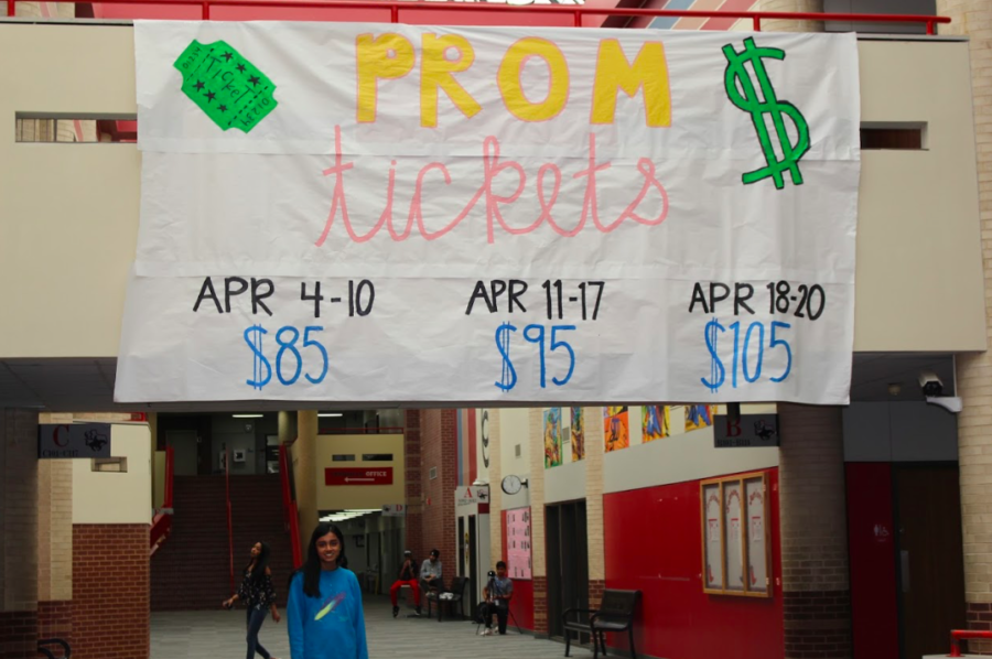 Senior+and+prom+queen+nominee+Riya+Mahesh+stands+underneath+the+prom+tickets+banner+on+the+senior+bridge.+Prom+is+Saturday+night+and+Mahesh%2C+along+with+other+seniors%2C+are+excited+to+hang+out+with+her+friends+and+conclude+senior+year.