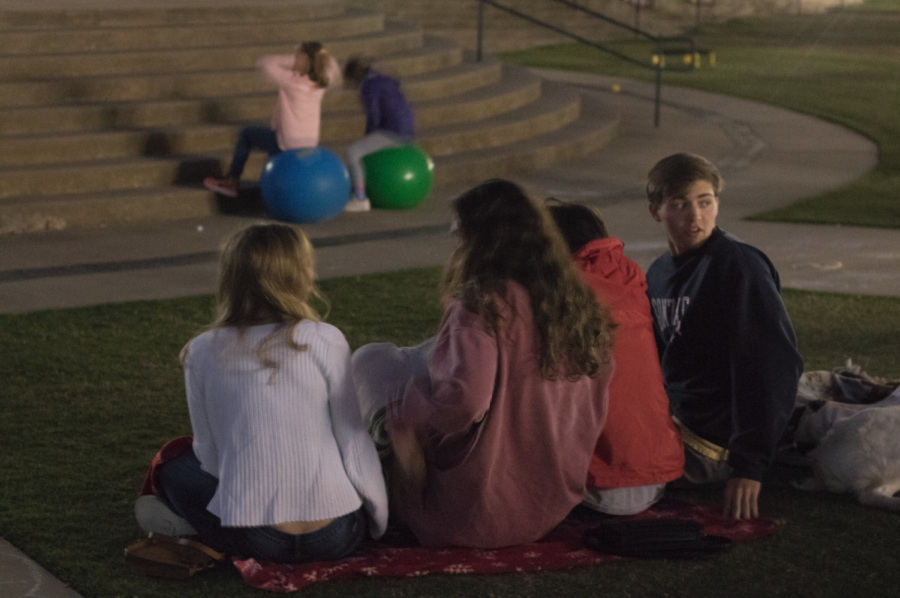 CHS students sit together to watch a screening of “Rapunzel” on Saturday evening from 6 - 10 p.m. at the Town Center Plaza to fundraise for A Night for Nepal. A Night for Nepal is an organization working to raise money for the reconstruction of schools in Nepal following the devastating earthquake that took place three years ago.