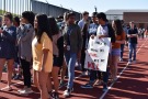 Coppell High School students walk out with posters at the Coppell High School walkout today in the track. The walkout was attended by approximately 700 high school students in support of gun control and school safety.
