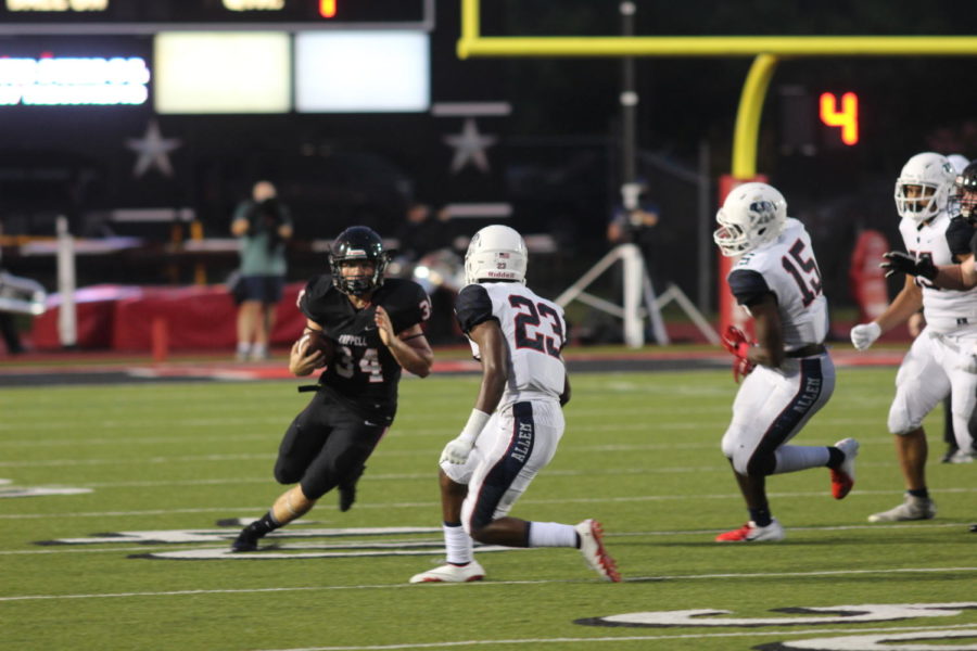 Coppell High School senior running back Ryan Hirt runs past Allen Eagles on an outside run at Buddy Echols Field on Sep. 20 The Cowboys lost to the Allen Eagles, 21-0.