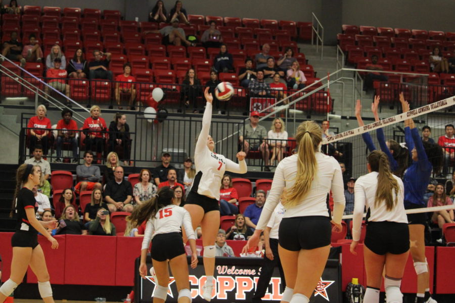 Coppell High School senior Pierce Woodall goes up to spike the ball during the match at CHS Arena against Waxahachie on August 11th. The Cowgirls beat the Waxahachie High School Indians, winning 2 out of 3 sets.