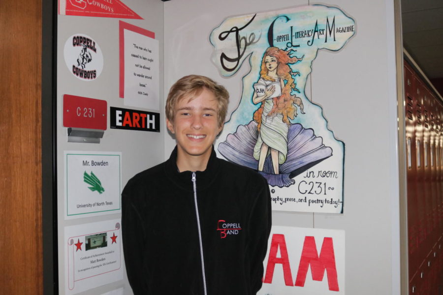 Coppell High School junior Jaxon Shealy poses in front of the Coppell Literary Art Magazine. This 2018 -2019 school year, Shealy brings his techniques and skills to Coppell High School by becoming the president of the Creative Writing Club. 