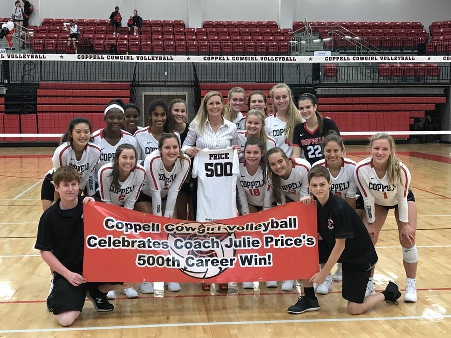 Coppell volleyball coach Julie Price celebrates her 500th career win, with her team. The Cowgirls swept the top-ranked Byron Nelson 25-16, 25-20, 25-18 on Aug. 28.