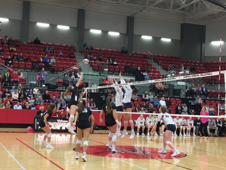 Coppell+High+School+senior+Pierce+Woodall+jumps+to+spike+the+ball+during+the+match+against+Flower+Mound+High+School+on+Oct.+16.+The+Lady+Jaguars+defeated+Coppell+Cowgirls+3+to+1.+Photo+by+Bailey+Lai.