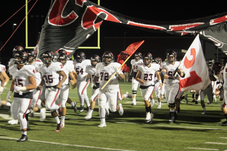 The Coppell Cowboys run out after halftime at Hebron High School statism on Oct. 5. Coppell Cowboys defeated Hebron Hawks 16-15. 