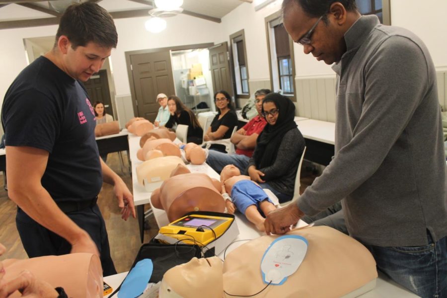 Coppell firefighter and paramedic Daniel-Mark Knight and attendee Ramesh Chittipolu set up the automated external defibrillator (AED) device at the Coppell Life Safety Park’s monthly CPR-AED class on Saturday morning. Firefighters from the Coppell Fire Department instruct the classes about basic first aid tactics, use of the AED device in case of cardiac arrest in infants, children and adults.