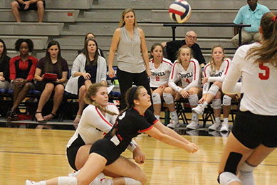 Coppell High School senior Stella Yan sets the ball to teammates during the Hebron match against Hebron High School on Oct. 5. The Hebron Hawks defeated Coppell Cowboys 3 to 0. Photo by Gabby Nelson.