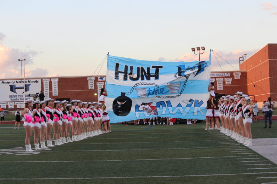 Coppell football team prepares to run through the banner for the start of their football game against Hebron on Friday Oct 5 at Hebron High School. The Coppell Cowboys defeated Hebron Hawks 16-15. 