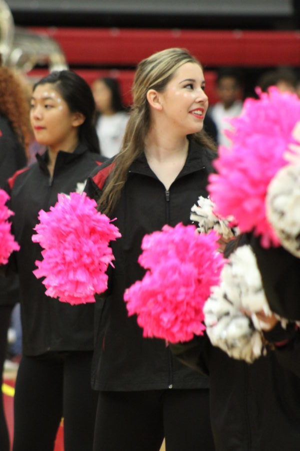 Coppell High School senior Saige Culler performs with the Lariettes during the pep rally on Oct. 18. Culler was a cheerleader throughout her first two years of high school, but became a Lariette her senior year. 