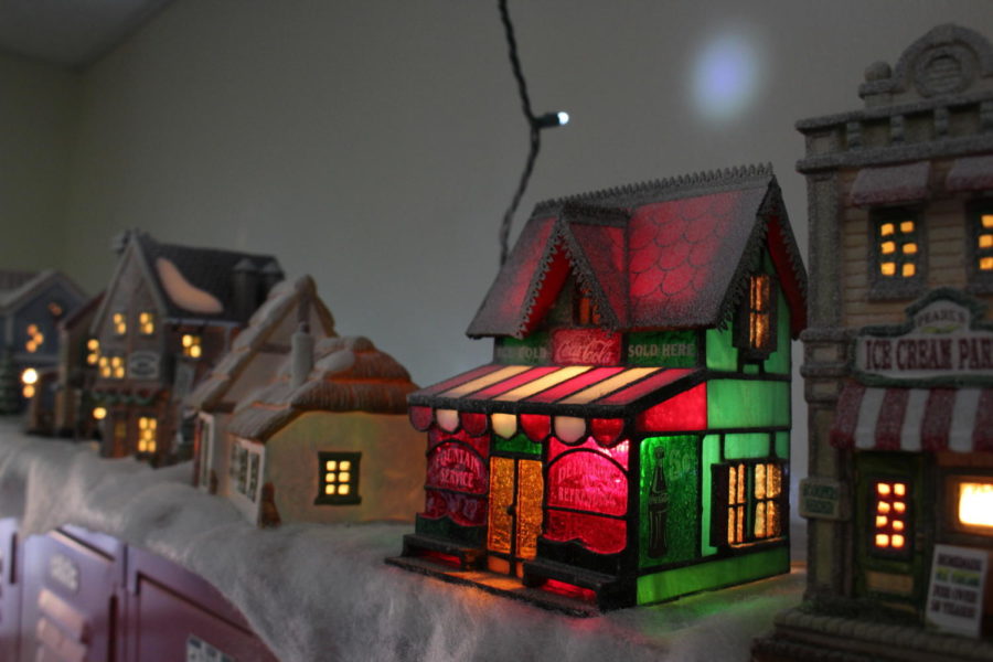 Coppell+High+School+Emergency+Medical+Technician+and+Pharmacy+tech+teacher%2C+Gary+Beyers+has+set+up+a+miniature+holiday+village+and+a+large+wintertime+train+set+display+in+and+out+of+A110.+The+Christmas+village+has+fake+snow+and+music%2C+with+a+train+track+set+up+inside+his+room.+A+wreath+hangs+on+Beyer%E2%80%99s+door.+