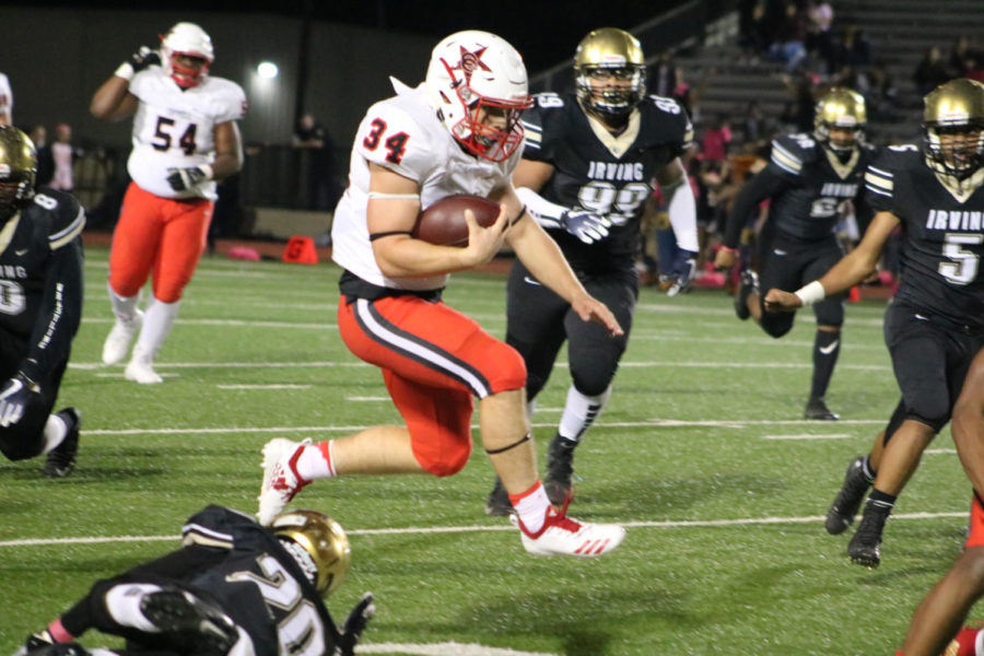 Coppell senior running back Ryan Hirt runs the ball towards Cowboys end zone
during the game at Joy & Ralph Ellis Stadium on Oct. 26. The Coppell Cowboys
defeated the Irving Tigers 48-13.