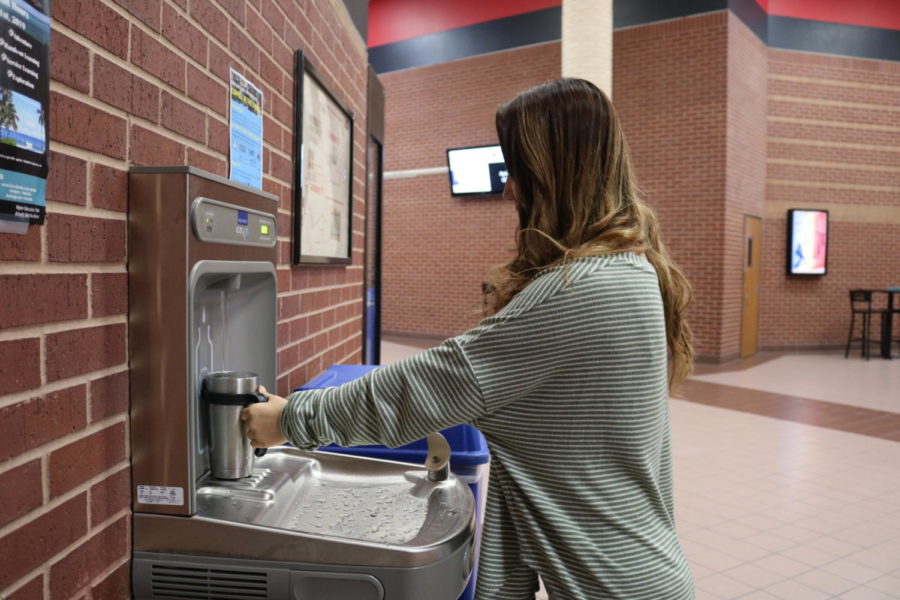 Coppell High School sophomore Lauren Mun uses the new addition of water fountains located near the CHS cafeteria which was Coppell High School’s campus senior gift from the graduating class of 2017. The water fountains have promoted students bringing reusable water bottles to school. 