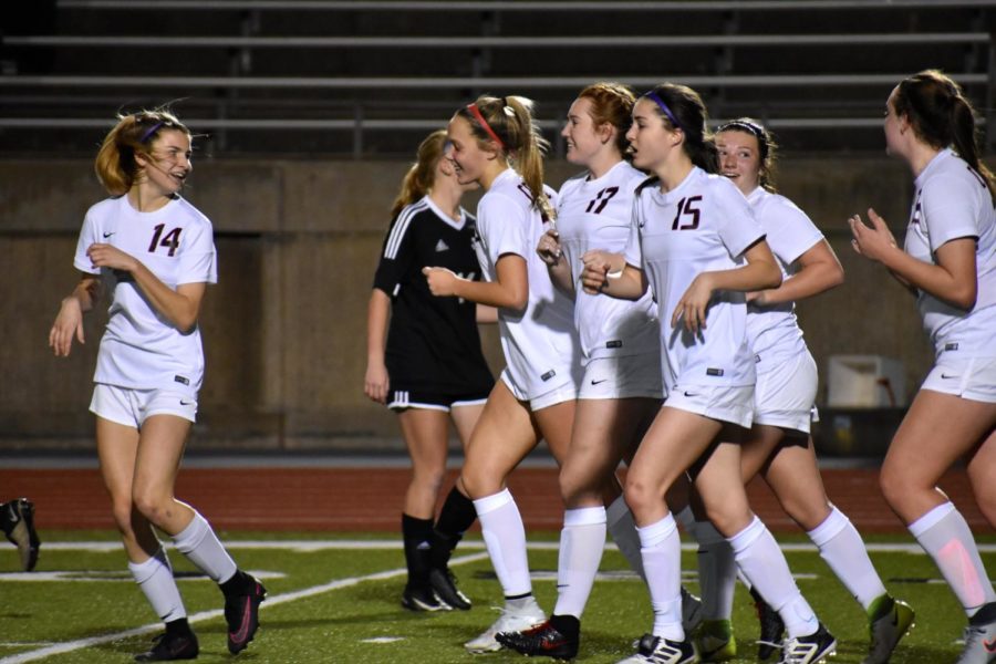 The+Coppell+girls+soccer+team+celebrates+after+a+goal+during+a+match+against+Lake+Highlands+in+the+2017-2018+season.+The+Cowgirls+will+play+Paschal+on+Tuesday+at+7%3A30+p.m.+at+CHS9.+