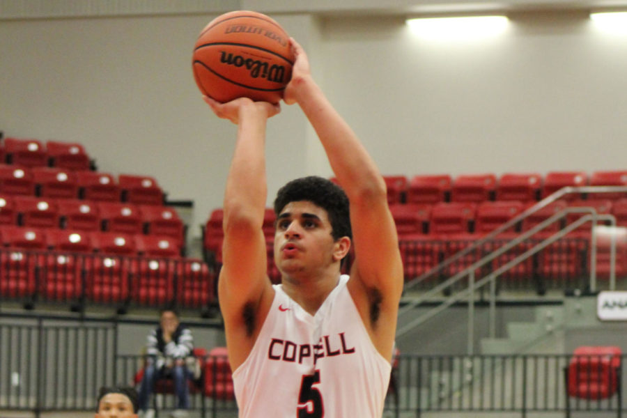 Coppell High School junior Adam Moussa shoots a free throw during the Cowboys’ game against Flower Mound on Tuesday. Coppell plays again tonight away at Irving-Nimitz High School.