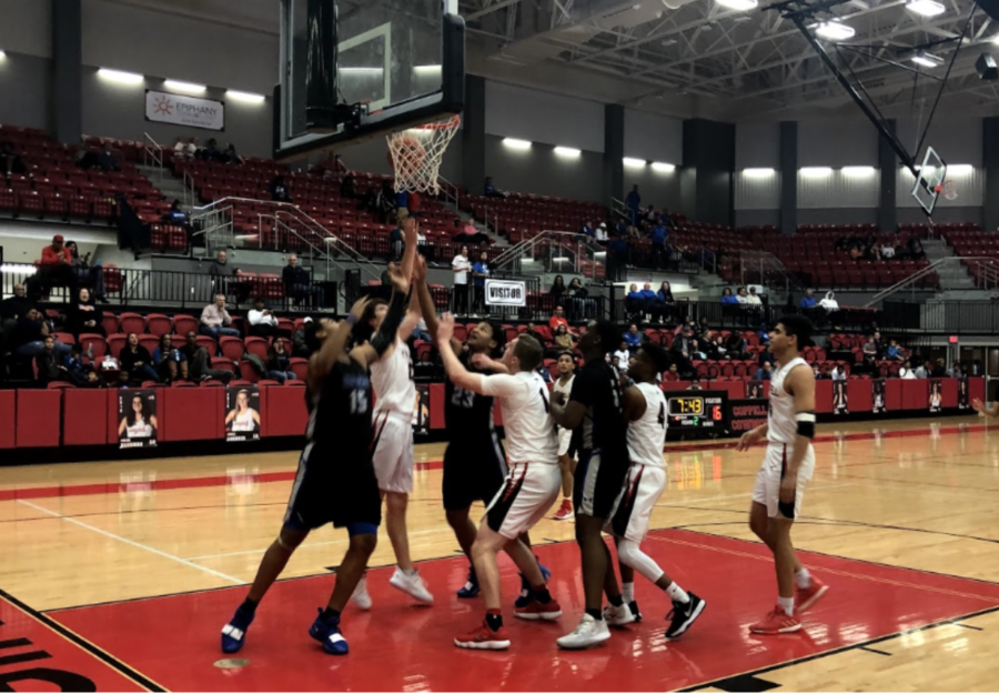 In the final moments of the second quarter in Friday’s game, the Coppell Cowboys and Hebron Hawks struggle for possession of the ball in the Coppell High School arena. The Cowboys defeated the Hawks, 50-43, in their seventh district game. 