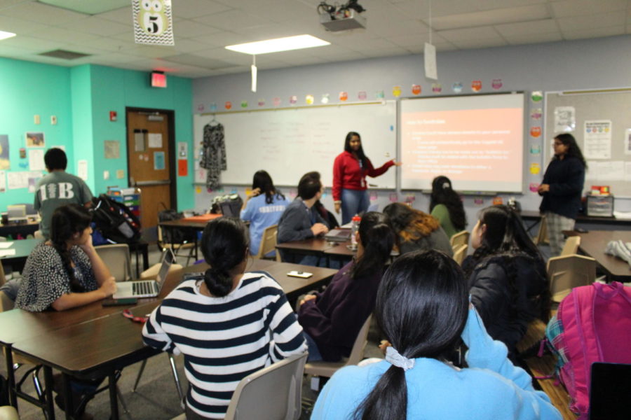 Coppell High School juniors Ananya Pagadala and Anjali Satpathy explain to their group members how to set up a fundraising account. The Build On Club’s purpose is to raise money for underdeveloped countries to build schools.